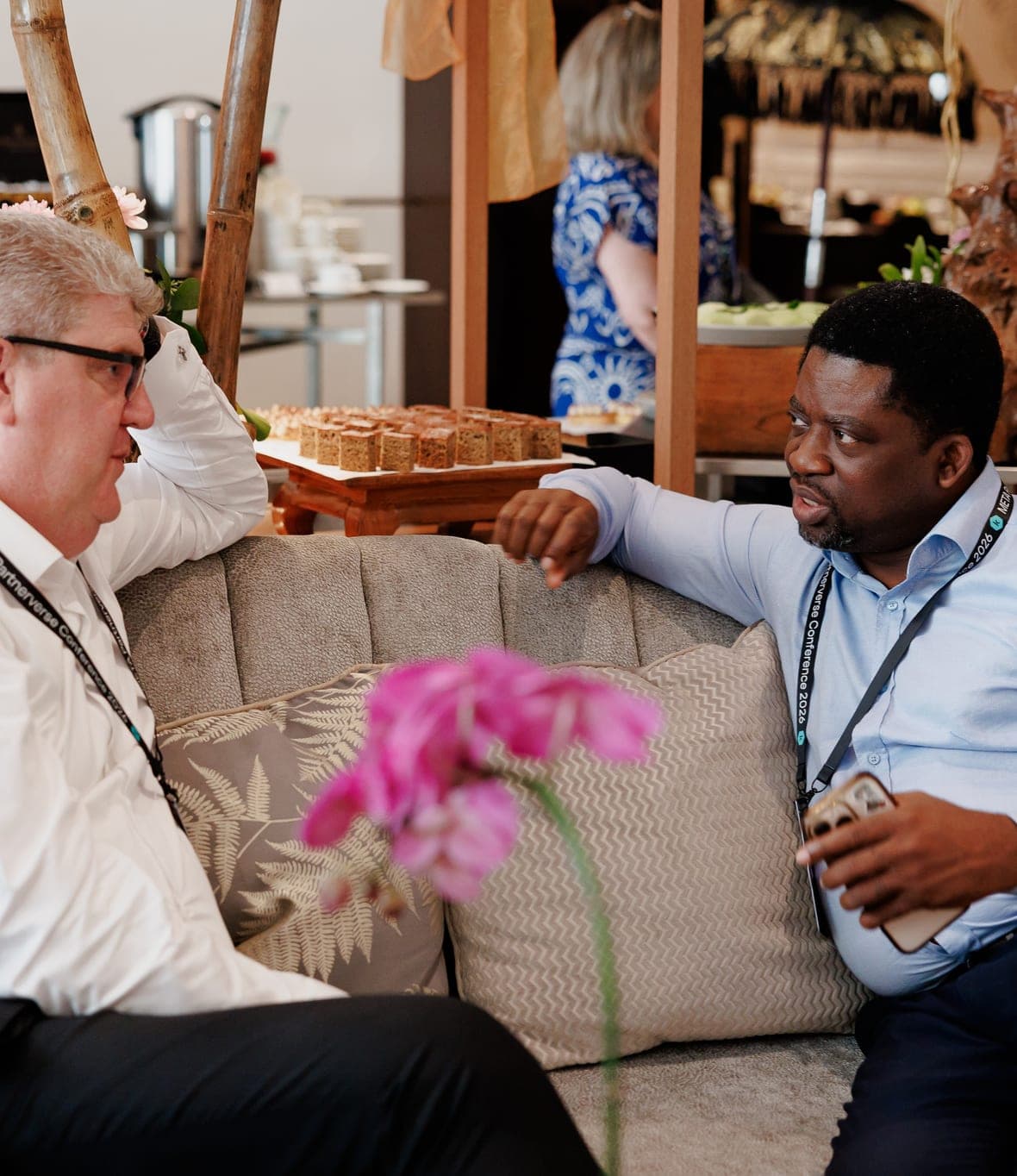 Segun Akande in conversation with a delegate at a conference