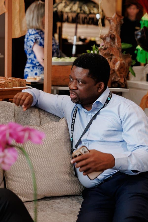 Segun Akande in conversation at a conference lounge
